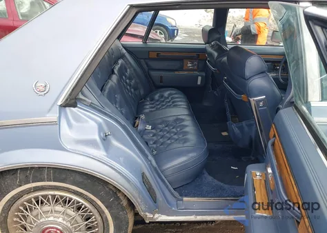 1984 Cadillac Seville z USA, uszkodzony, nr VIN 1G6AS6989EE826093